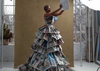 Artful Innovation: A Unique Newspaper Dress Shines in a Creative Photoshoot